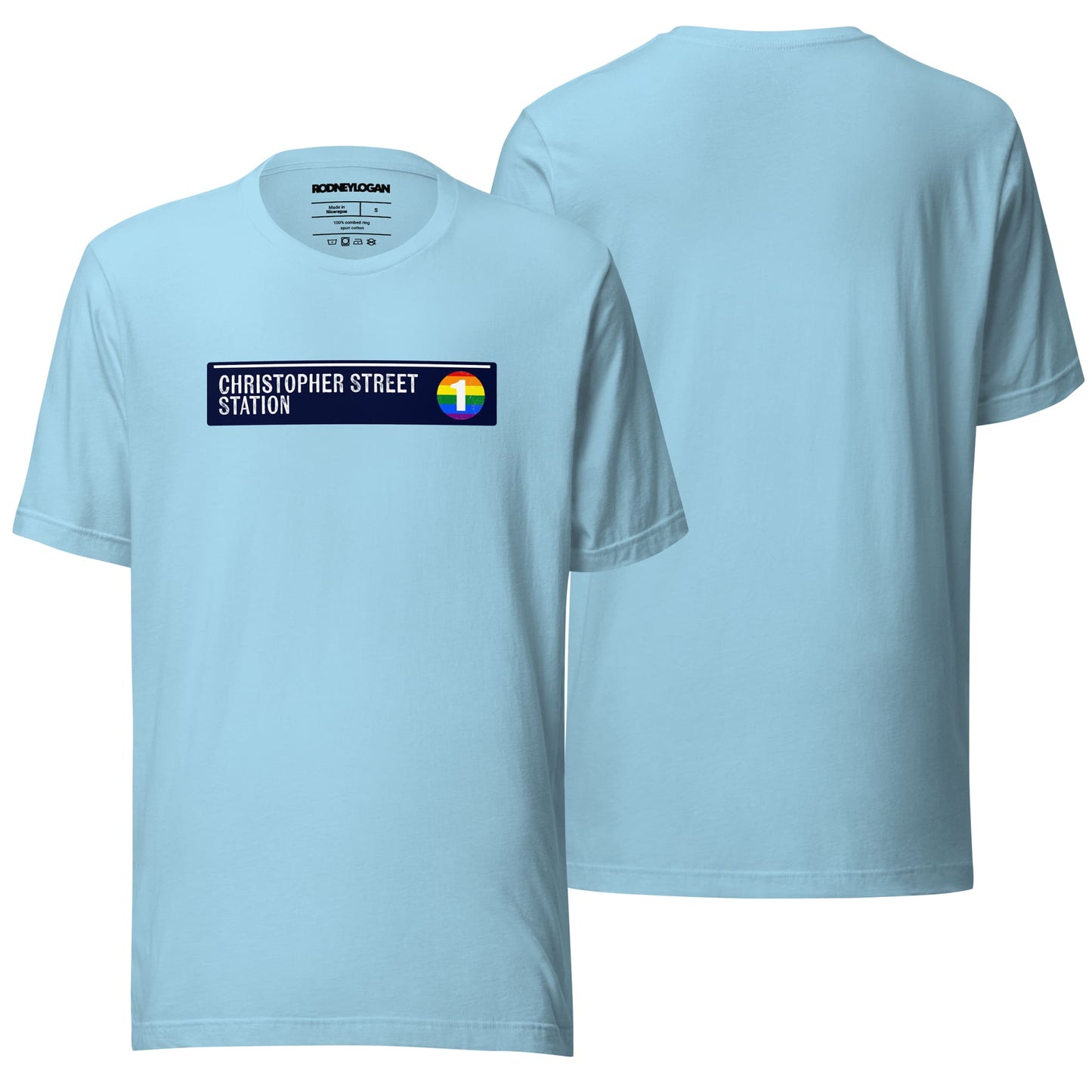 A crewneck T-shirt in a deep ocean blue shade, adorned with "Christopher Street Station" text on the front. The image highlights its laid-back and versatile design against a clean, neutral background.