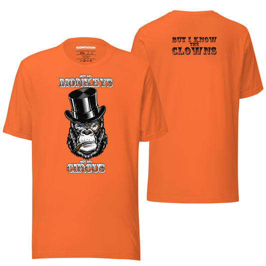 A bold orange t-shirt featuring the "Not My Monkeys, Not My Circus" design with playful typography and a touch of humor. The vibrant color makes it a standout piece for casual, fun styling.